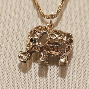 Goldtone filigree elephant pendant on a twisted goldtone chain